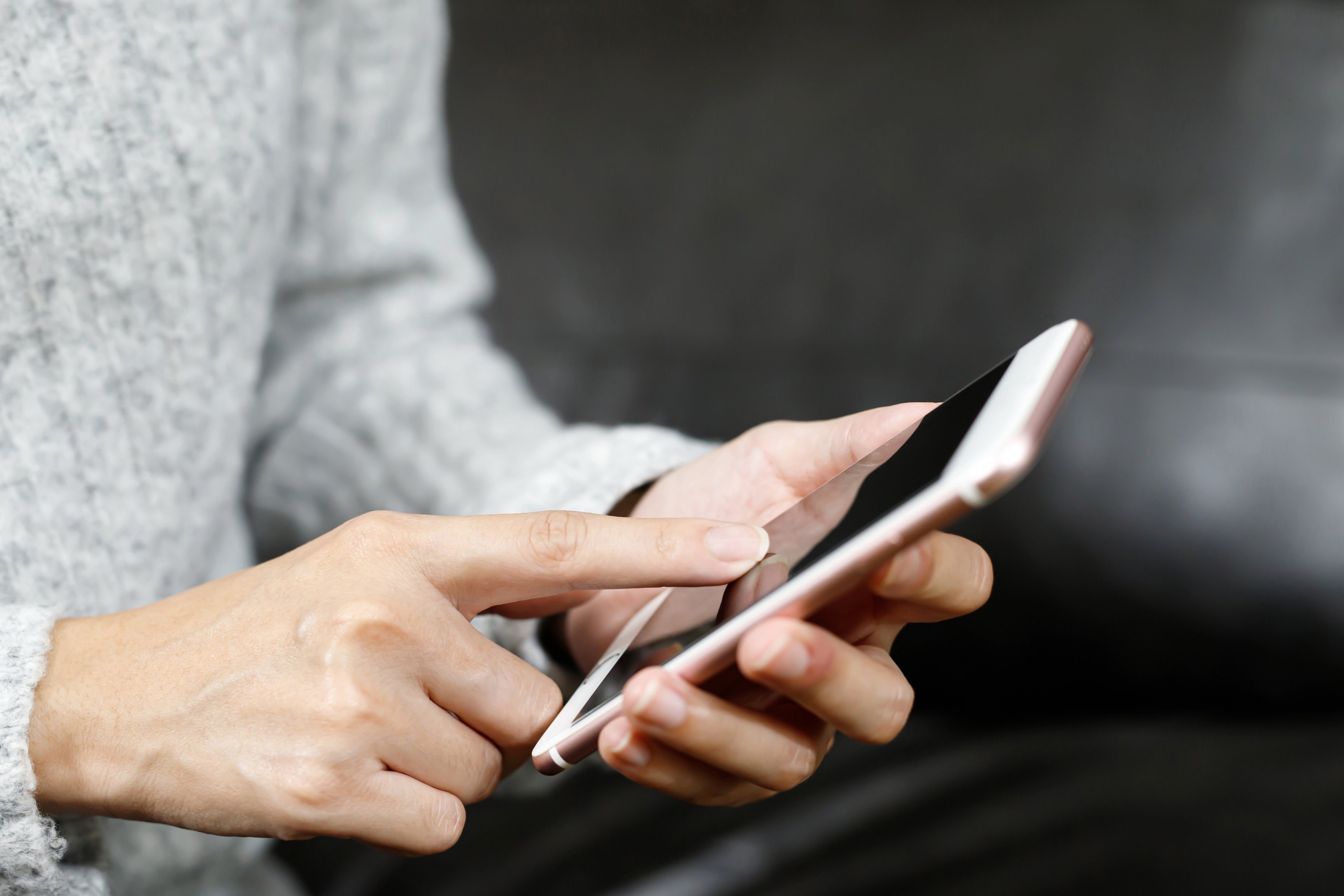 Woman Using Phone Indoors